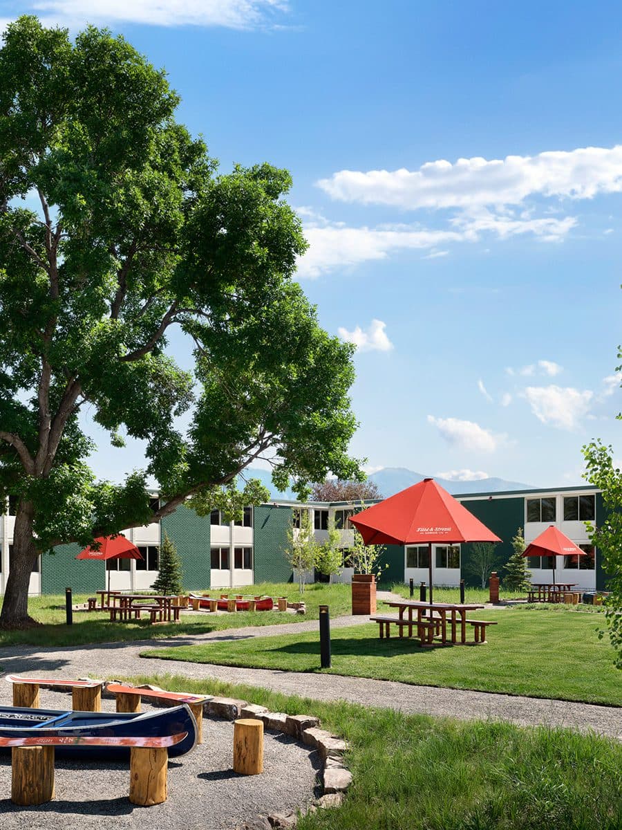 The Backyard with picnic tables and canoe fire pits
