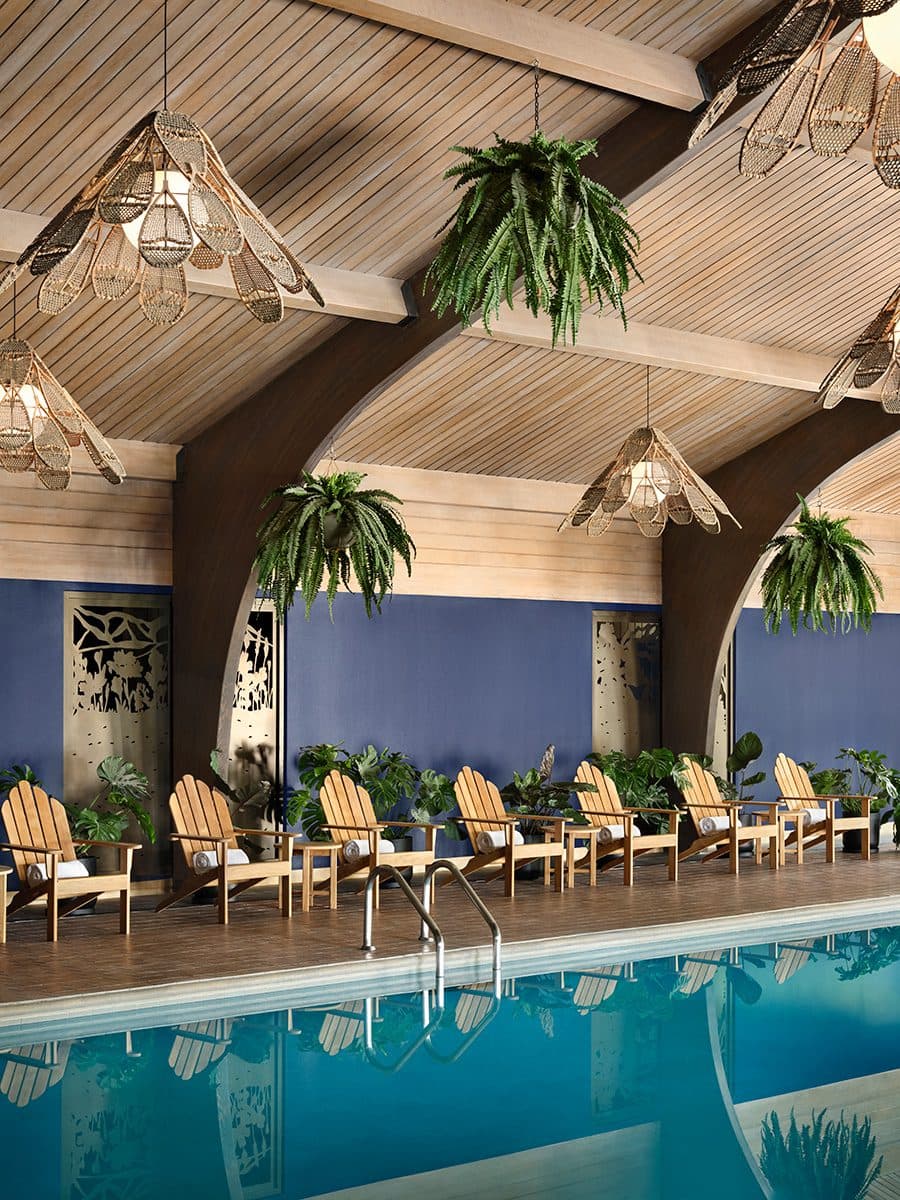 indoor pool with adirondack chairs